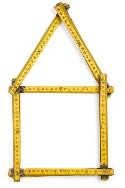 Carpenter's meter gevormd als een huis Stockfoto
