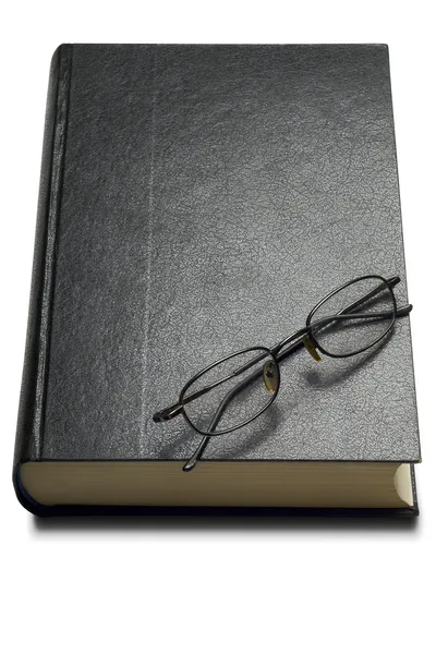 Livro e óculos Imagens Royalty-Free
