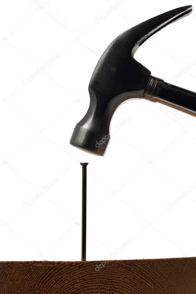 A hammer hitting a nail