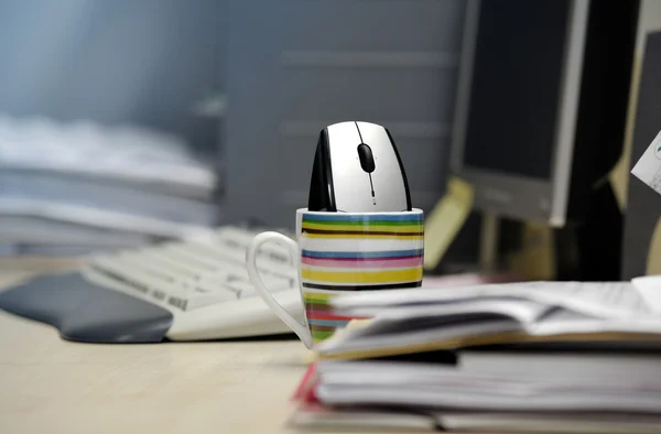 Computer mouse inside a mug — Stock Photo, Image