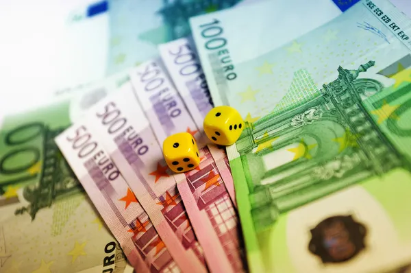 Stock image Dice on thousands of euro