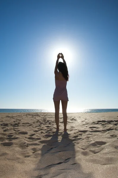 Stock image Woman touching the sun