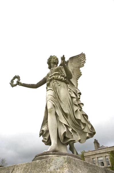 Winged woman sculpture — Stock Photo, Image
