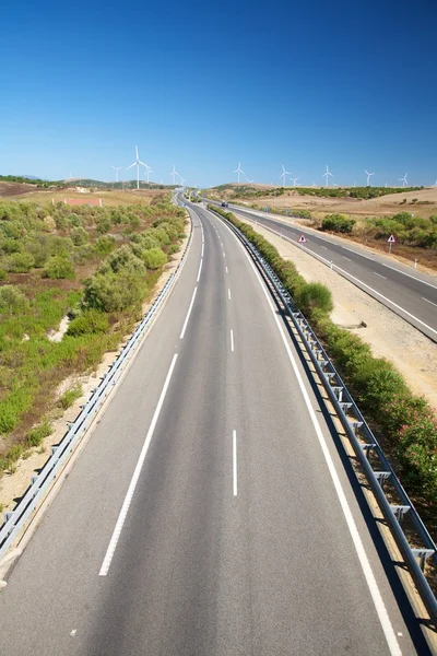 Far windmills and highway — Stock Photo, Image