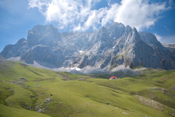 Cliff over cottage in Cantabrian mountains