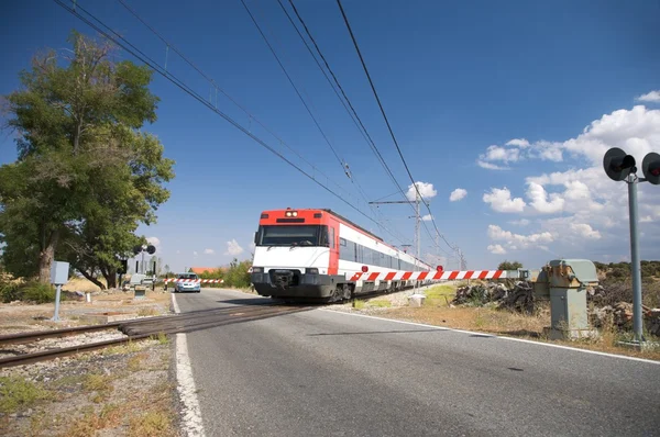 Train at level crossing — Stock Photo, Image