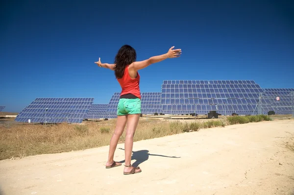 stock image Red woman greeting solar panels