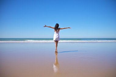 Happy white dress woman at Castilnovo beach clipart