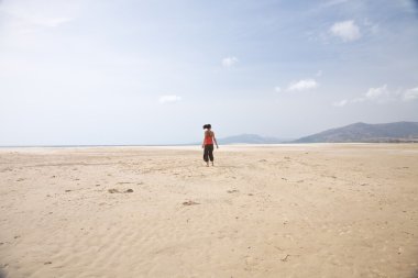 Back woman at Lances beach clipart