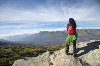 Watching cloud over valley at Gredos clipart