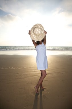 Woman behind straw hat clipart