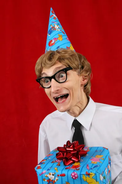 Cute party boy with a gift — Stock Photo, Image