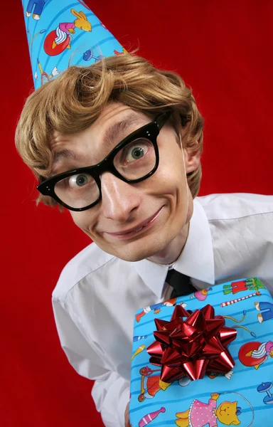 Cute party boy with a gift — Stock Photo, Image
