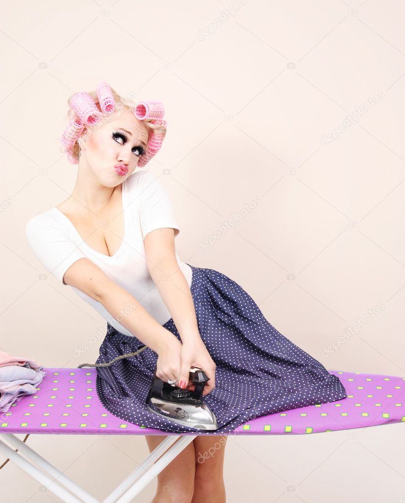 Funny girl ironing skirt
