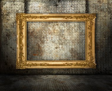 Grunge interior with gold frame clipart