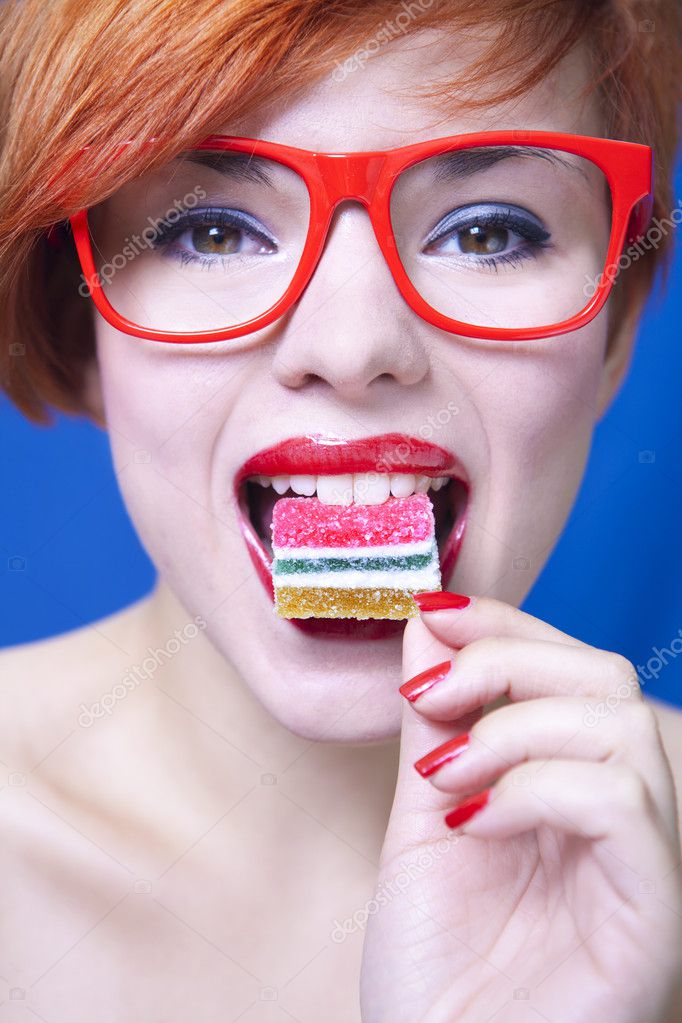 Pretty girl eating candy — Stock Photo © NinaMalyna 6684786