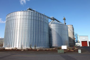 Steel grain silos in The Dalles Oregon clipart