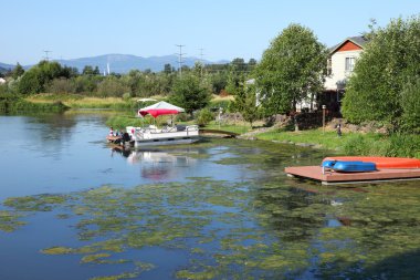 Lakeside houses with access to water. clipart