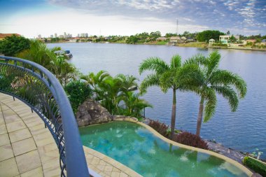 Balcony views from waterfront Mansion with Pool overlooking the clipart