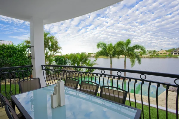 Balcony entertainment area of waterfront house — Stock Photo, Image