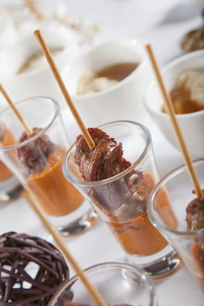 stock image Asian Fusion lamb on stick in shot glass with sauce