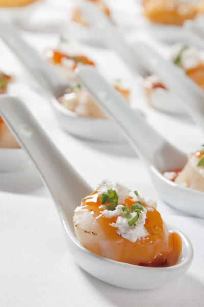 Scallops served on spoon — Stock Photo, Image