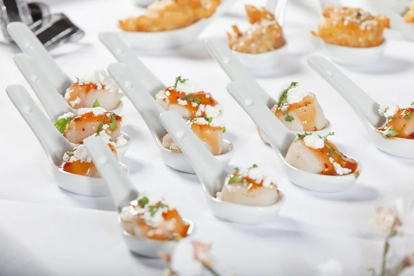 Scallops served on spoon — Stock Photo, Image