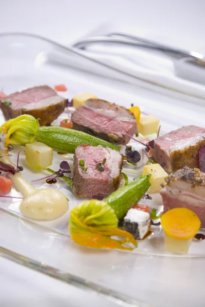 Lamb served with vegetables and sauce — Stock Photo, Image