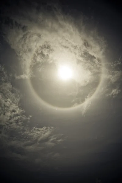 Sun with sircular rainbow and clouds — Stock Photo, Image