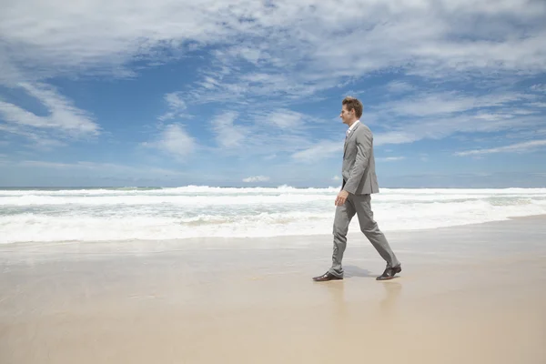 stock image Business man on the beach