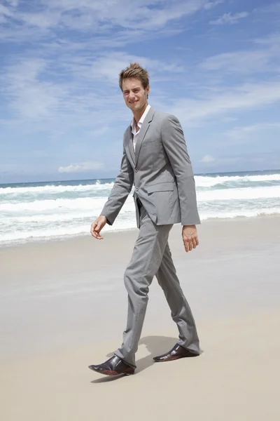 Stock image Business man on the beach