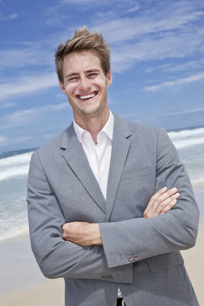 stock image Business man on the beach