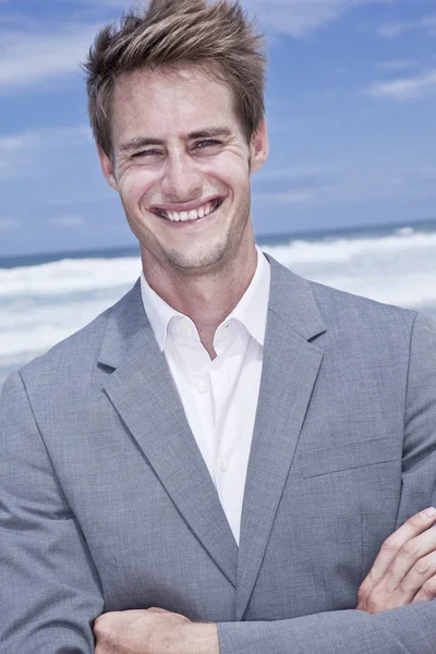 stock image Business man on the beach