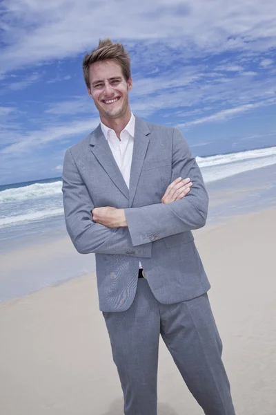 stock image Business man on the beach