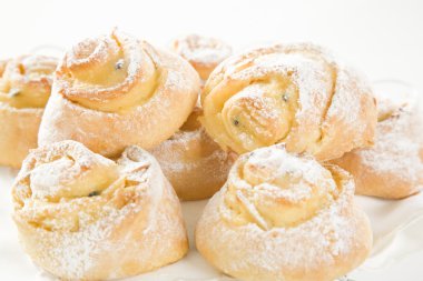 Sweet Savoury buns with white icing clipart