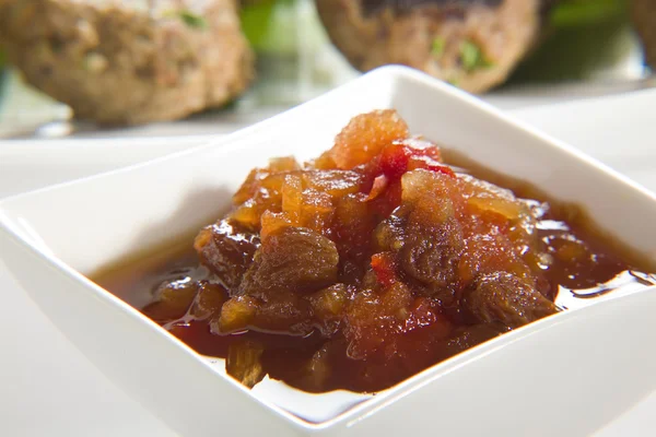 stock image Chutney with meatballs in background