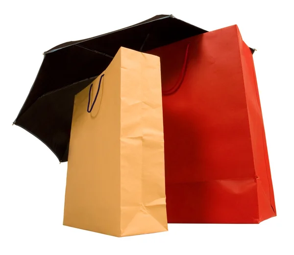 Shopping bags with umbrella — Stock Photo, Image