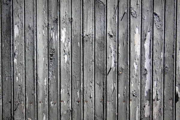 Vecchia vernice su recinzione in legno scuro — Foto Stock
