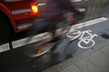 Cyclist in rain clipart