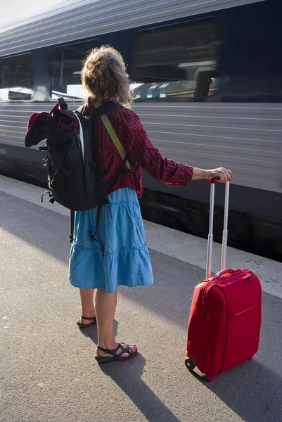 stock image Woman with roller bag