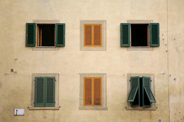Green for real and yellow for fake windows seen in a little Italian town.