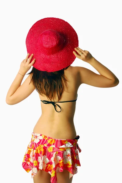 Mooi meisje met een rode stro hoed — Stockfoto