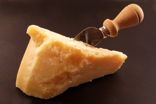 Piece of Parmesan cheese as an appetizer or for grating over pas