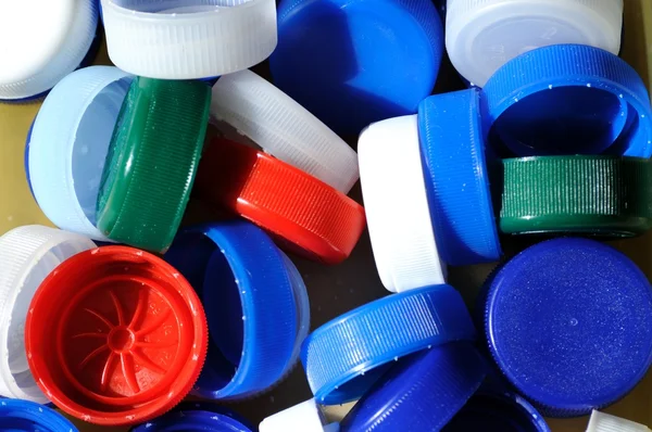 Műanyag kupakok háttér Stock Fotó