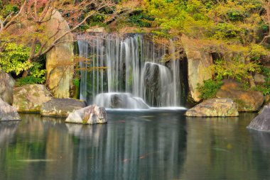 Waterfall in a Japanese zen garden clipart
