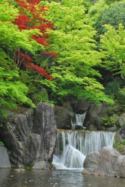 Waterfall in a Japanese zen garden clipart