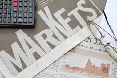 Closeup of markets text and financial graph clipart