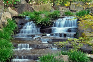 Waterfall in a Japanese zen garden clipart