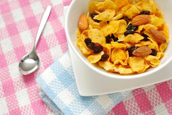 Breakfast cereal with raisins and almond nuts — Stock Photo, Image