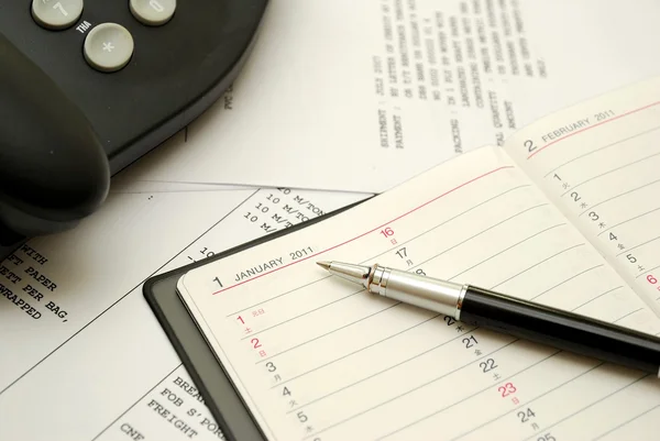 Black pen on planner — Stock Photo, Image